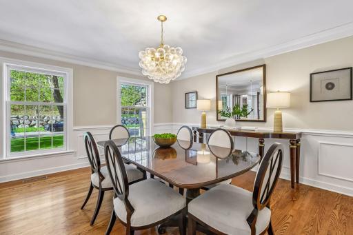 Formal dining room with statement light fixture