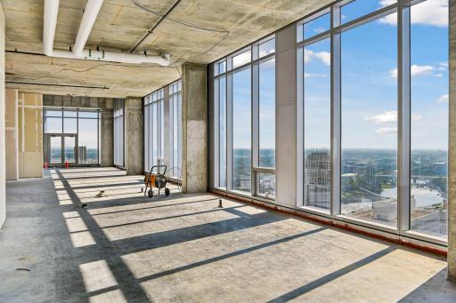 Penthouse sold as raw unbuilt space w/18' ceilings & panoramic views.