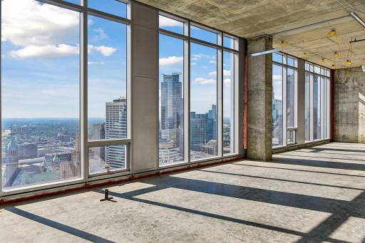 Penthouse sold as raw unbuilt space w/18' ceilings & panoramic views.