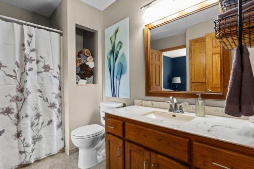 The upper level includes a full bathroom.