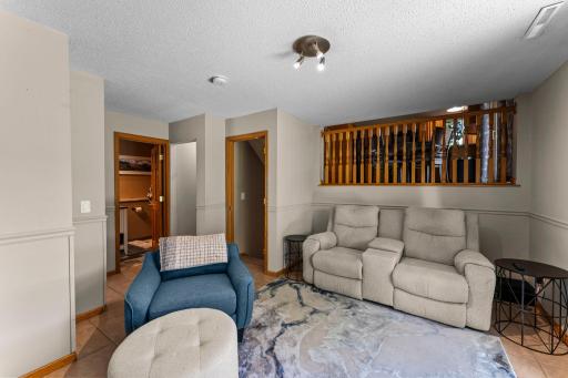 The family room is on the lower level and offers access to the back patio.