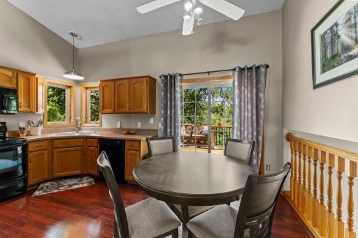 The dining area includes access to the deck.