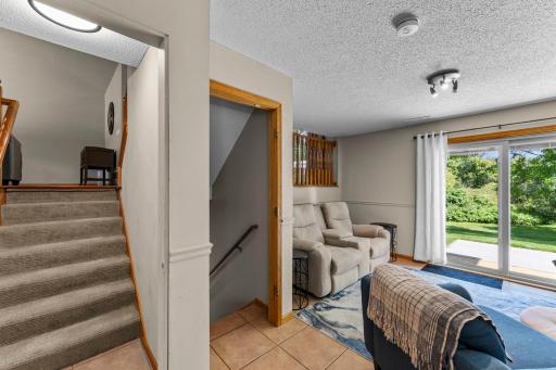 The family room is on the lower level and offers access to the back patio.