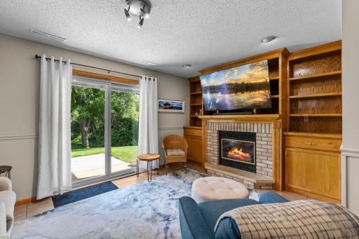 The family room is centered around a beautiful gas fireplace.