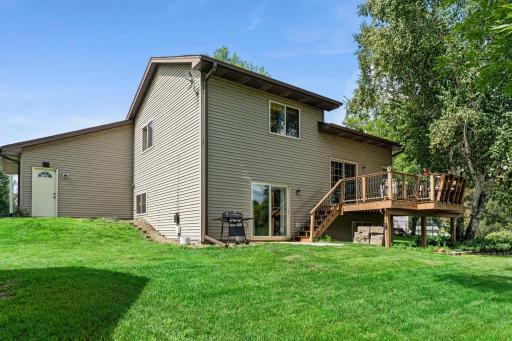 The backyard offers plenty of green space to enjoy.
