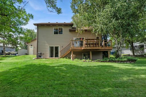 The backyard offers plenty of green space to enjoy.