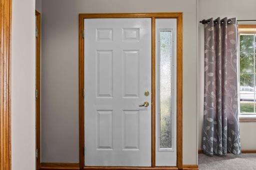The main entry features a stylish frosted sidelight.