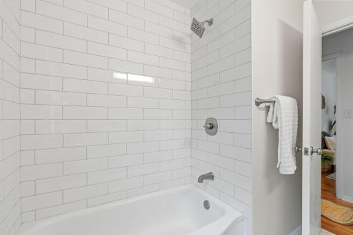 Sleek new tub with modern wall tile for a fresh, updated look.
