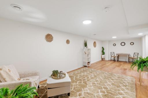 Large versatile lower-level living space with a clean, updated look throughout.