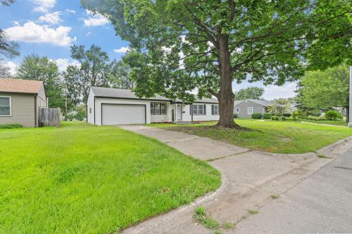 Front exterior with attached two-car garage and welcoming curb appeal.