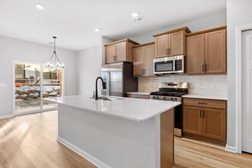 Photo for 23189 Creekview Court, Rogers, MN 55374 - listing #6774429 The Hayward designer kitchen with an island perfect centerpiece for cooking, dining and gathering with friends and family.