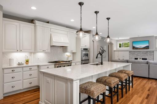 Quartz countertops, herringbone back splash and a breakfast bar