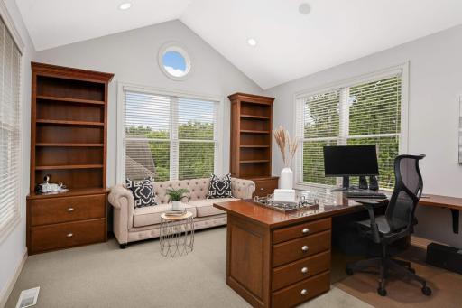 Vaulted main floor office with windows on 3 sides