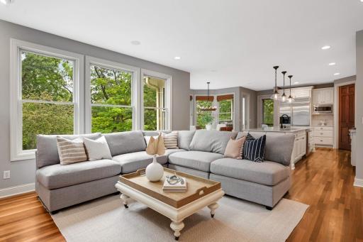 Open concept, family room, kitchen and informal dining all surrounded by large windows