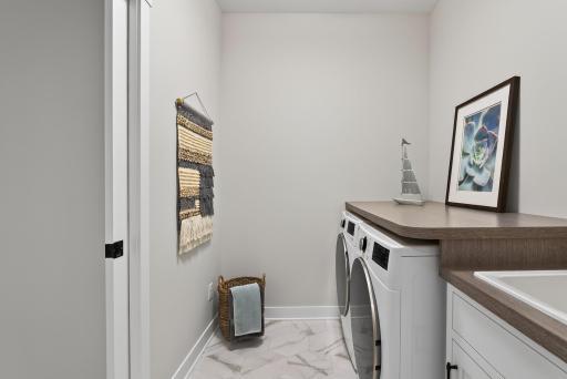 Laundry room is located off the primary walk-in closet and mudroom - making this chore a breeze.