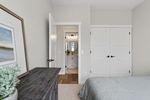 Large double door closet and convenient Guest Bath across the hall.
