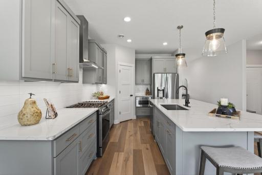 LG high end appliances. Dual fuel stove, counter depth French door refrigerator, drawer microwave and stainless steel premium outside vented hood.