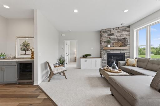 Built-in cabinet to left of fireplace is wired above for wall mounted TV.