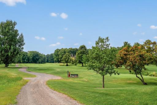 Neighborhood cart path leading to the course.