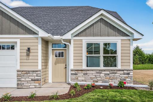 Quality construction details: Andersen Windows, Pre-finished LP SmartSide front, Stone accent, Gutters and Concrete Driveway.