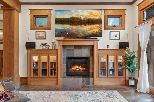 Toasty gas fireplace with custom cabinetry and TV mount (it drops down/is easily adjustable)...