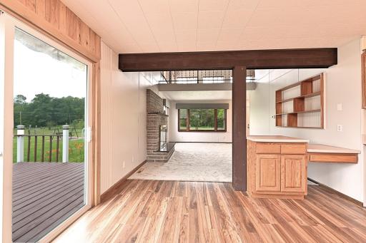 DINING AREA TO LIVING ROOM WITH WALKOUT TO THE DECK