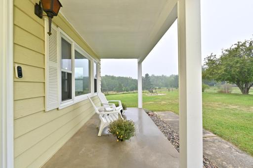 COVERED FRONT PORCH IS A GREAT SPOT TO START OR END YOUR DAY!