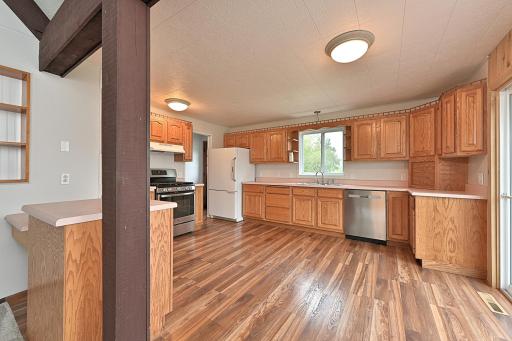 KITCHEN HAS AN ABUNDANCE OF BEAUITUFL OAK CABINETS.