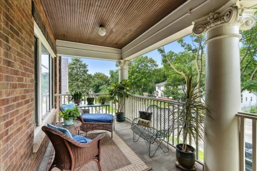 This is YOUR own veranda, perfect for a morning cup of coffee or full workday. Note the original bead board ceiling and elegant pillars that characterize the Pullman style condos of the early 1900's. All of this in the heart of NE!