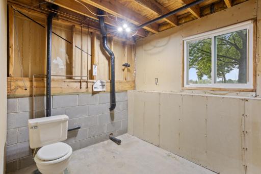Gain equity in finishing the 2nd bath. Toilet is functioning. A full bath with tub/shower and sink would fit easily into this space.