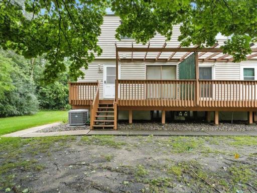 Enjoy the spacious shared green space and mature trees surrounding this end-unit townhome, offering privacy.