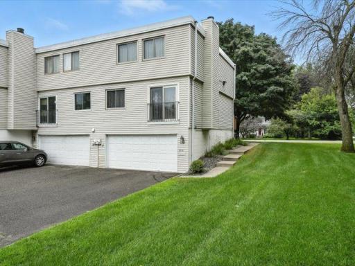 Highly desirable end-unit location with extra green space and mature landscaping along the side.