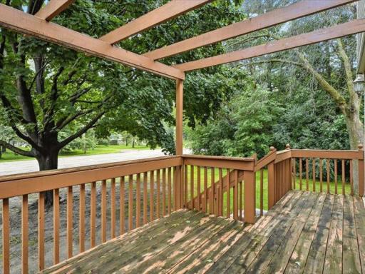 Step outside to your private deck, perfect for morning coffee or evening relaxation. The pergola above adds charm and potential for outdoor dÃ©cor.