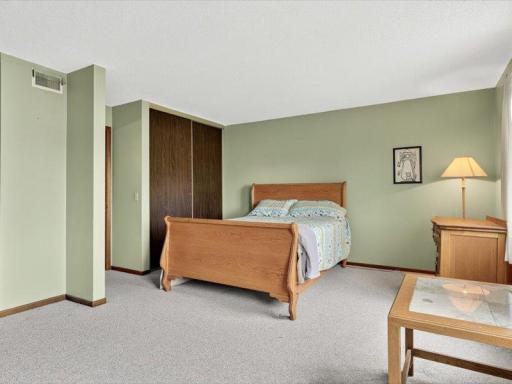 Expansive bedroom with large windows that fill the space with natural light.