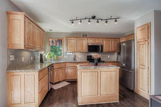Ample cabinet space and a center island highlight the kitchen