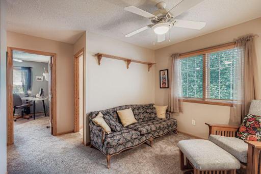 The second floor loft at the top of the stairs is a prime spot to relax or have an office