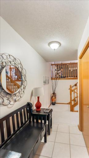 Large entry with coat closet and access door to the garage