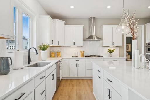 (*Photo of decorated model, actual homes colors and finishes will vary) Enjoy the gourmet kitchen in this home!