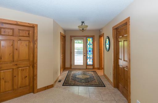 The Main Entry to the Home. Pine Panel Doors Throughout the Home.