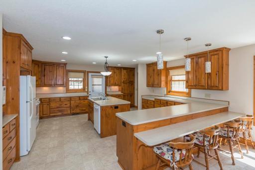The Spacious Kitchen Has Beautiful Pine Cabinets In Immaculate Condition. Large Work Areas and There is a Baking Station