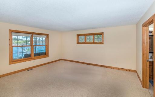 The Main Level Lakeside Owner's Suite Has a Beautiful View of Bass Lake