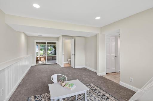 Lower level family room leads to a walk-out screened porch