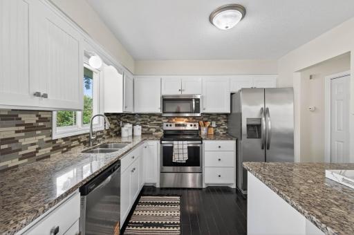 Freshly painted cabinets add a modern touch.