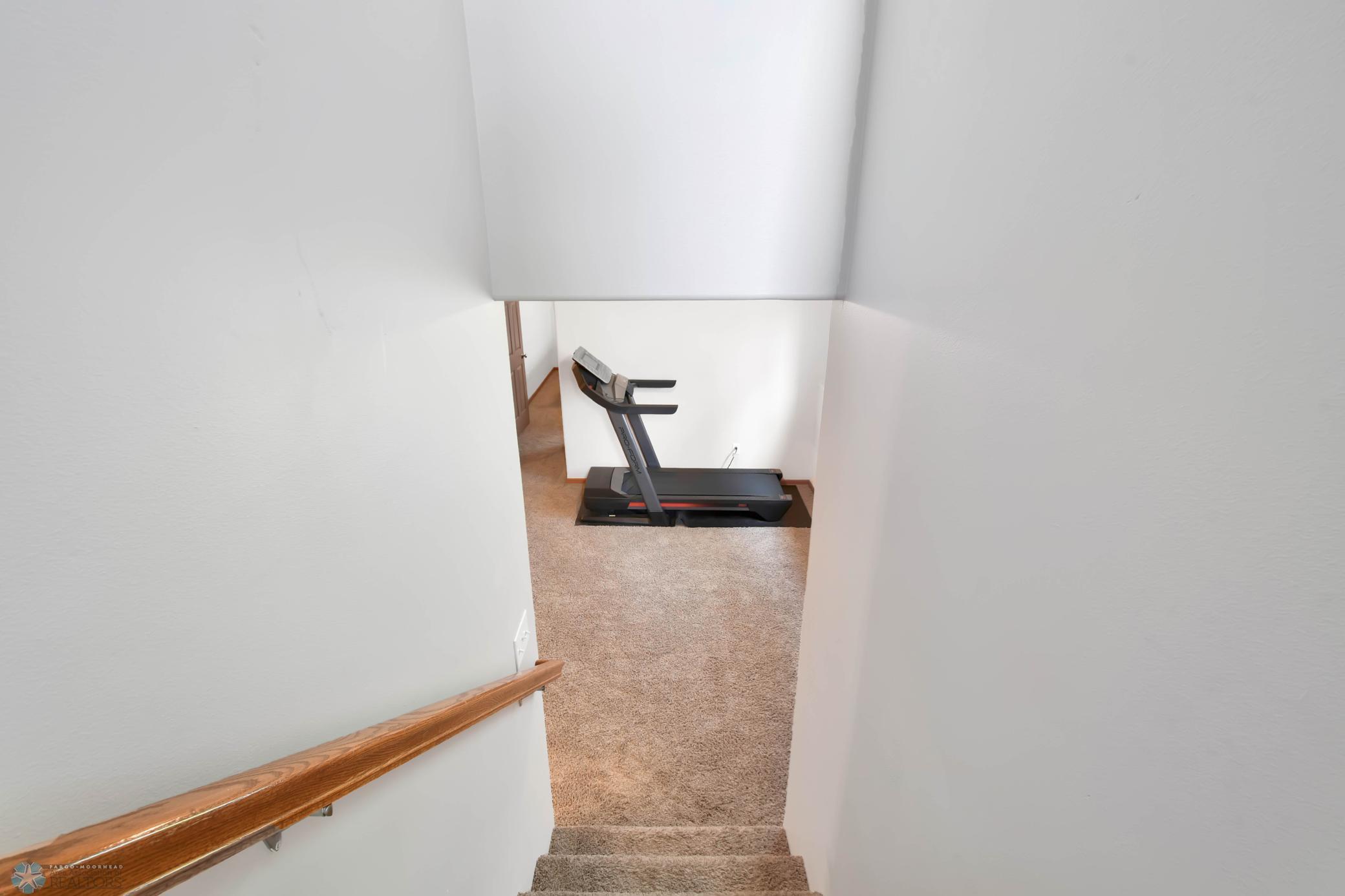 Staircase off foyer to lower level
