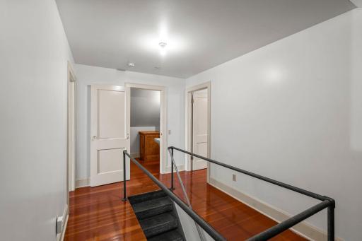 Upstairs features stylish, neutral pallette with solid paneled doors, light trim. Beautiful flooring spans the entire upper level.