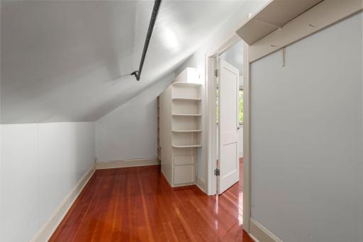 Walk in closet on the upper level with built-ins.