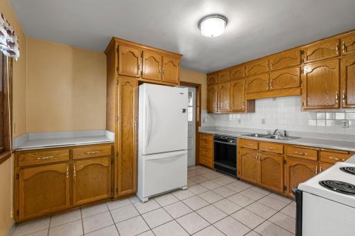 Abundance of natural oak cabinetry, buffet area and ceramic tiled floors.