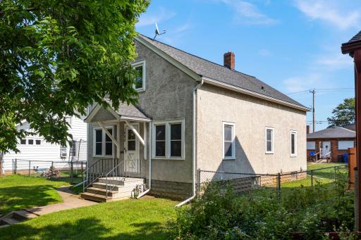 Fully fenced in backyard with oversized, garage and storage shed.