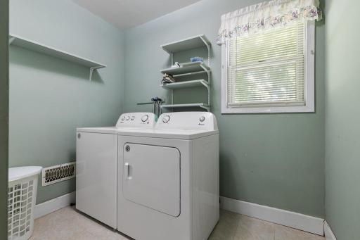Main floor laundry room! Just inside the garage entryway and next to the bathroom for utmost convenience!