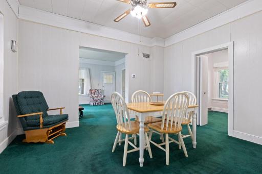 A formal dining room rests between the living room and kitchen